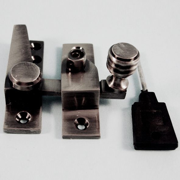 THD184L/AN • Locking • Antique Nickel • Locking Straight Arm Reeded Knob Sash Fastener